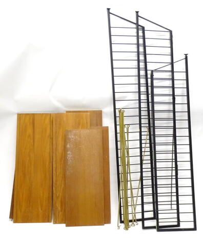 A section of Staples Ladderax shelving, comprising two ebonised metal ends and a single smaller section, with four large and five smaller shelves and metal supports.