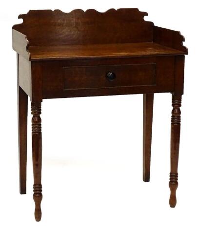 A 19thC oak washstand, with a shaped raised back, frieze drawer on turned tapering legs, 76cm wide.