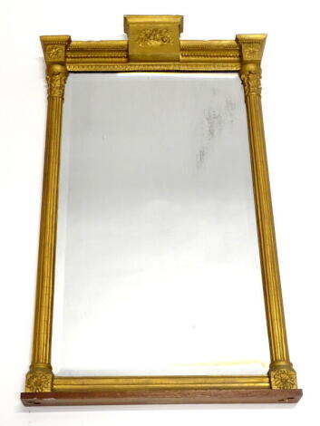 A 19thC gilt gesso mantle mirror, with a central fruit cast table to the frieze above a rectangular bevel plate, flanked by fluted pilasters, 87cm high, 50cm wide.