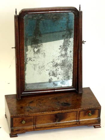 A 19thC walnut dressing table mirror, the rectangular mirror plate on tapering supports, the chequer banded box base with three drawers on ogee bracket feet, 39cm wide.