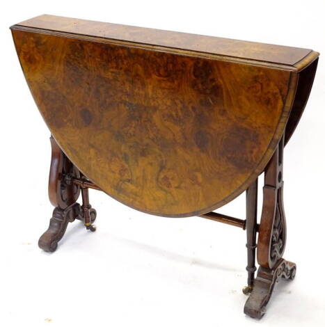 A Victorian burr walnut Sutherland table, the quarter veneered oval top with a moulded edge on pierced end supports, 90cm wide. Provenance: The Estate of Miss Rachel Monson.