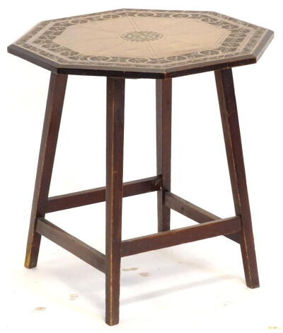 A late 19th/early 20thC walnut occasional table, the octagonal top with chip carved decoration and poker work initials, A G H M, on square tapering legs, 51cm wide. Provenance: The Estate of Miss Rachel Monson.