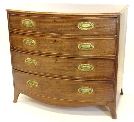 A George III mahogany bow fronted chest of drawers, the top with a moulded edge above four graduated drawers, each with oval brass drop handles and splayed feet, 84cm high, 92cm wide, 57cm deep.