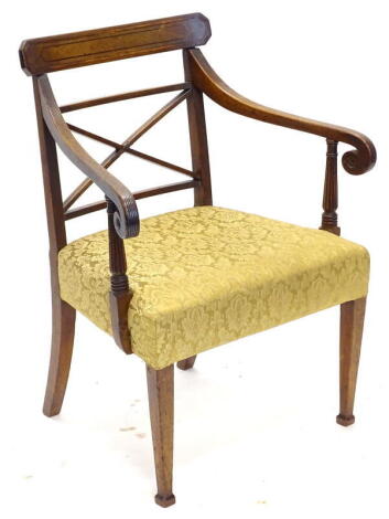 An early 19thC mahogany and ebony strung open armchair, the back with X shaped support, with reeded arms and supports, a padded seat on square tapering legs. Provenance: The Estate of Miss Rachel Monson.