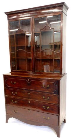 A George III mahogany secretaire bookcase, the top with a dentil cornice above too astragal glazed doors, enclosing adjustable shelves, the base with a cross banded border on a moulded edge, above a fitted drawer and three further long drawers, each with 