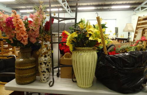 A collection of artificial flowers, vases, stands, to include an iron pan stand, etc.