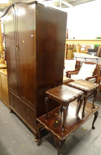 A nest of three mahogany coffee tables, each on cabriole legs, comprising larger rectangular table and two small tables, and a walnut wardrobe.