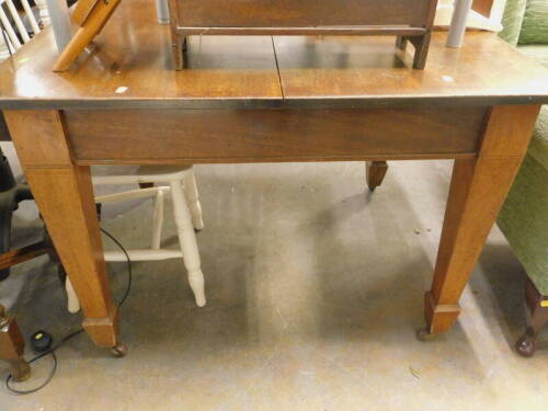 A mahogany extending dining table.