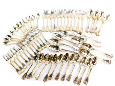 A William IV silver fiddle and shell pattern set of table flat ware, comprising twelve table, dessert and tea spoons, twelve table and dessert forks, Mary Chawner, London 1834/35, 138.38oz.