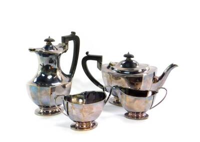 A silver four piece tea set, of fluted footed form, Sheffield 1962/64, comprising teapot, hot water jug, cream jug and sugar bowl, 45.76oz. all in.