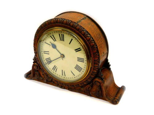 A Victorian oak cased double sided wall clock, possibly from a railway station or retail store, each with an enamelled metal dial bearing Roman numerals, single fusee movement, the case carved with hare bells and laurel leaves, the bezel with egg and dart