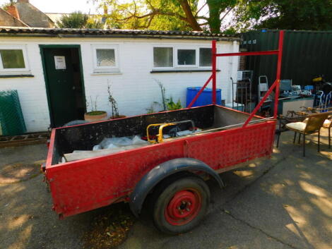 A red metal framed trailer, single axle, 246cm long, 122.5cm wide.