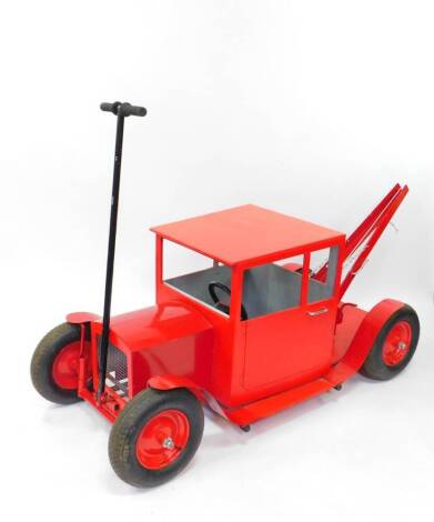 A red model tow truck, plywood and fabricated metal bodied, 180cm long.
