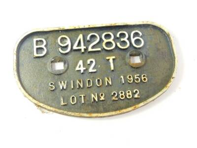 A railway wagon cast iron plate, white on high relief, 'B942836, 42T, Swindon 1956, Lot 2882'., 28cm wide.