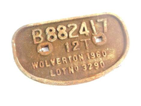 A cast iron wagon plaque, white paint high relief, 'B882417, 12T, Wolverton 1960, Lot No 3290'., 28cm wide.