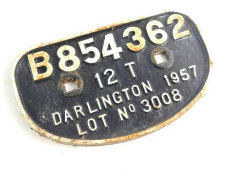 A cast iron wagon plaque, white paint high relief, 'B854362, 12T, Darlington 1957, Lot No 3008'., 28cm wide.