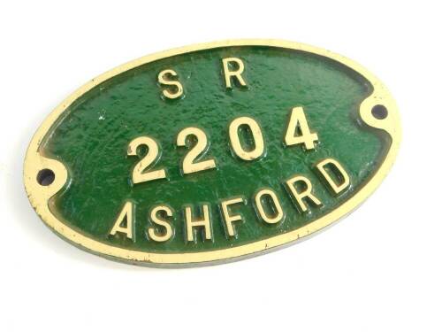 A Southern Railways cast iron wagon plate, white painted high relief against a green ground, 'SR2204 Ashford'., 25cm wide.