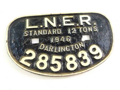 A cast iron wagon plate, white painted high relief, 'LNER, Standard 12 tonnes, 1946, Darlington, 285839'., 27.5cm wide.