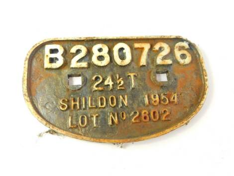 A cast iron wagon plate, white painted high relief, 'B280726, 24 1/2T, Shildon 1954, Lot No 2602'., 28cm wide.