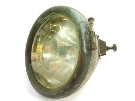 An early 20thC CAV car head lamp, metal cased, 24cm diameter.