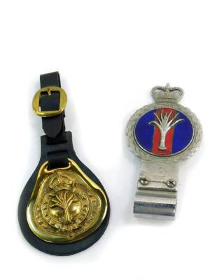 A J R Gaunt 1950's chrome and enamel Welsh Guards car badge, together with a Welsh Guards horse brass. (2)