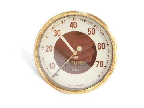 A Smiths Rev meter, believed to be for a Morris Ten, brown and white dial, serial no 53186/1/1600, 10cm diameter.