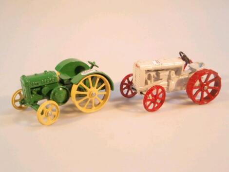 A die-cast model John Deere tractor and a die-cast model Fordson tractor