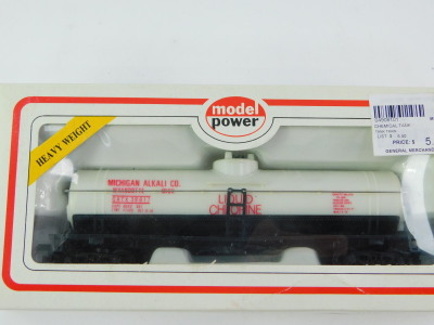 A Bachmann OO gauge locomotive chassis, 4-6-0, model power old time wooden passenger car, Denver and Rio Grande with a Western tank car, Hudson's Bay Oil and Gas, chemical tank wagon, Michigan Alkaline Company and another tank train, all boxed. (5) - 2