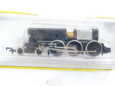 A Bachmann OO gauge locomotive chassis, 4-6-0, model power old time wooden passenger car, Denver and Rio Grande with a Western tank car, Hudson's Bay Oil and Gas, chemical tank wagon, Michigan Alkaline Company and another tank train, all boxed. (5) - 6