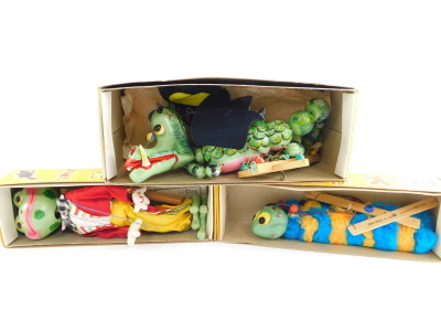 Three Pelham puppets, boxed, comprising Frog, Caterpillar and Dragon.