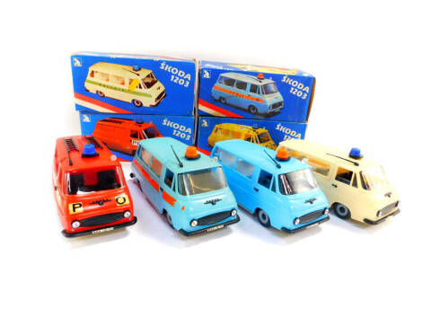 Four Kaden mechanical Police, Ambulance and Post Office vans, with friction action, boxed.