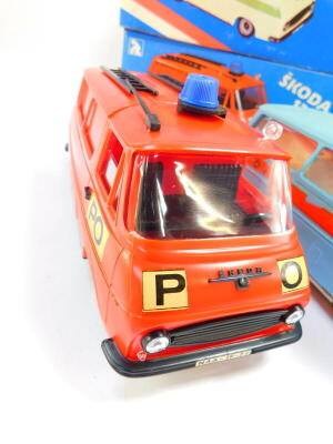 Four Kaden mechanical Police, Ambulance and Post Office vans, with friction action, boxed. - 2