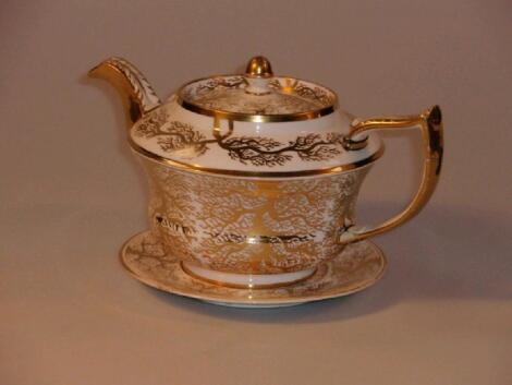 A 19thC English porcelain tea pot and stand