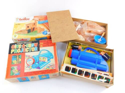 A Chad Valley give a show projector, battery operated with slides, boxed, together with a Tiefoc set, build and play with real bricks, with instruction for two models, TEI4140, boxed. (2)