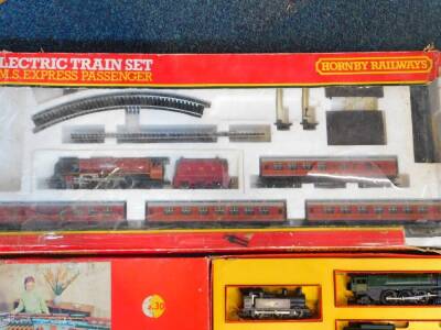 A Hornby electric OO gauge electric train set, LMS Express Passenger, with a 'Duchess of Sutherland' engine, 4-6-2, 6233, incomplete, boxed, together with a steam locomotive 'Britannia', British rail green livery, 4-6-2, 7000, three tank engines, coaches, - 4