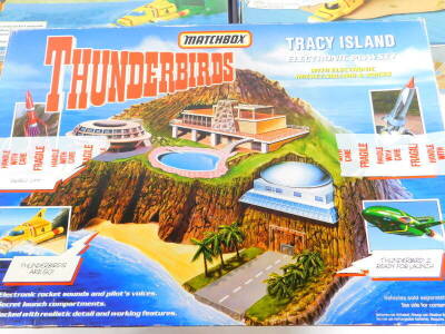 A Matchbox Thunderbirds Tracey Island electronic play set, with electronic rocket sounds and voices, and two Thunderbirds, Thunderbird 2 electronic play sets, with pilot commands and rocket sounds, all boxed. (3) - 2