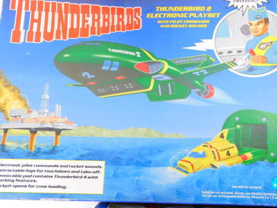 A Matchbox Thunderbirds Tracey Island electronic play set, with electronic rocket sounds and voices, and two Thunderbirds, Thunderbird 2 electronic play sets, with pilot commands and rocket sounds, all boxed. (3) - 3