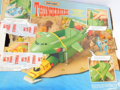 A Matchbox Thunderbirds Tracey Island electronic play set, with electronic rocket sounds and voices, and two Thunderbirds, Thunderbird 2 electronic play sets, with pilot commands and rocket sounds, all boxed. (3) - 4