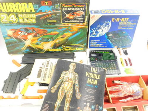 An Aurora AFX 24 hour race game, GX175O., Renwall The Invisible Man assembly kit, and an EX150 electronic experimenter kit. (3)