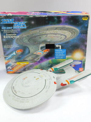 Games and toys, comprising Escape from Colditz, a Batman and Batmobile with rocket launcher, Captain Scarlet Spectrum command team and a Van Day play mates Star Trek, The Next Generation Starship Enterprise, all boxed. (4) - 5