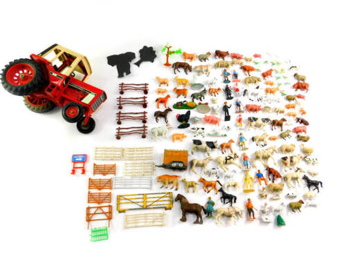 A diecast International 1086 tractor, together with plastic farm yard animals, fencing, further figures, etc. (2 trays)