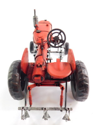 A tin plate red Farmall tractor, 34cm wide. - 3