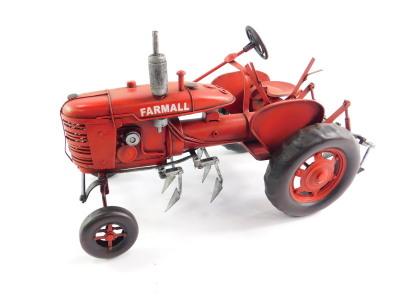 A tin plate red Farmall tractor, 34cm wide. - 4