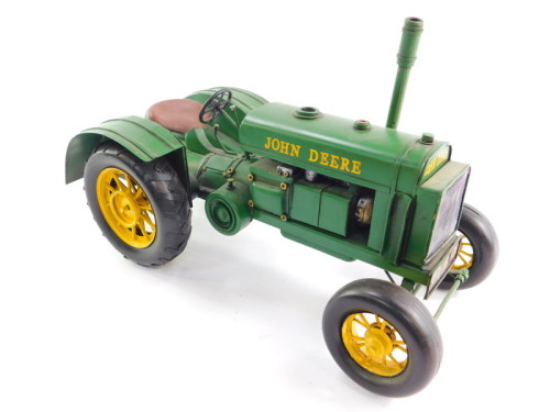 A tin plate model of a John Deere 1931 GP tractor, 38cm wide.