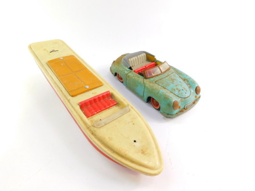 A Distler electromatic 7500 tin plate friction driven motorcar, together with a tin plate speed boat, with stop slow and fast lever control, 43cm wide. (2)