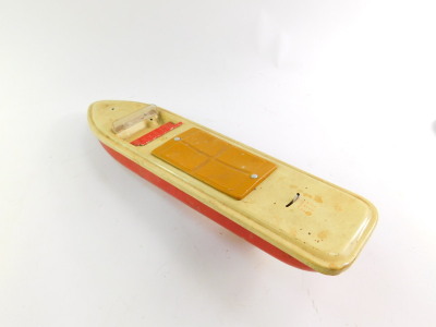 A Distler electromatic 7500 tin plate friction driven motorcar, together with a tin plate speed boat, with stop slow and fast lever control, 43cm wide. (2) - 3