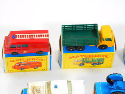 Lesney Matchbox die cast vehicles, boxed, comprising a jumbo crane, 11, hay trailer 40, Ford tractor 39, Land Rover fire truck, 57, Ford Zodiac 53, cattle truck 37, Mercedes Benz "Binz", ambulance 3, police car 55, stake truck 4, and a Dodge wreck truck 1 - 2