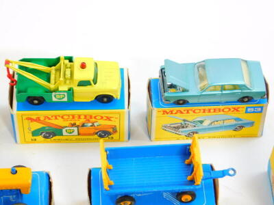 Lesney Matchbox die cast vehicles, boxed, comprising a jumbo crane, 11, hay trailer 40, Ford tractor 39, Land Rover fire truck, 57, Ford Zodiac 53, cattle truck 37, Mercedes Benz "Binz", ambulance 3, police car 55, stake truck 4, and a Dodge wreck truck 1 - 3