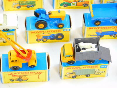 Lesney Matchbox die cast vehicles, boxed, comprising a jumbo crane, 11, hay trailer 40, Ford tractor 39, Land Rover fire truck, 57, Ford Zodiac 53, cattle truck 37, Mercedes Benz "Binz", ambulance 3, police car 55, stake truck 4, and a Dodge wreck truck 1 - 5