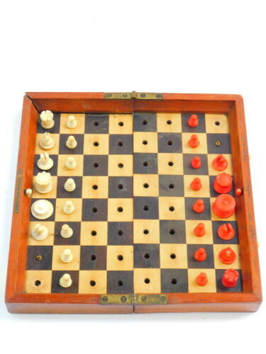 A Jacques & Son In Statu travelling chess set, cased, 23cm diameter. (AF)